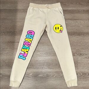 Fashion Nova Cream Sweatpants with Colorful PLAYHARD Print & Yellow Smiley